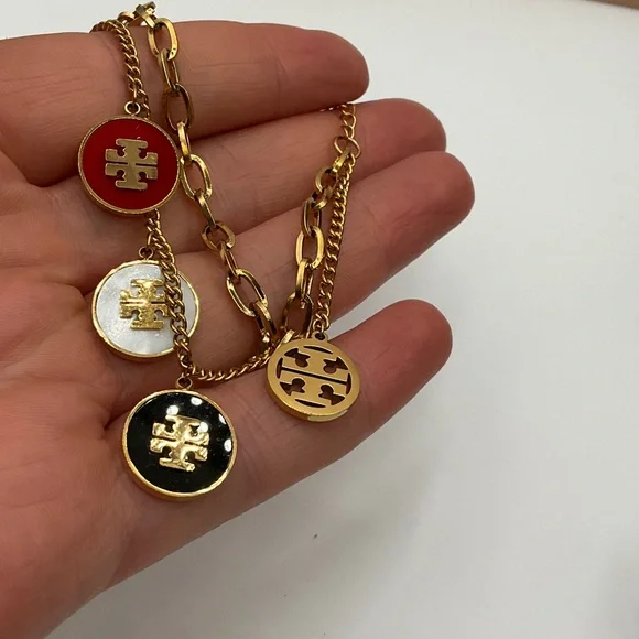 Tory Burch Gold Bracelet with Red, White, and Black Charms - Picture 4 of 5